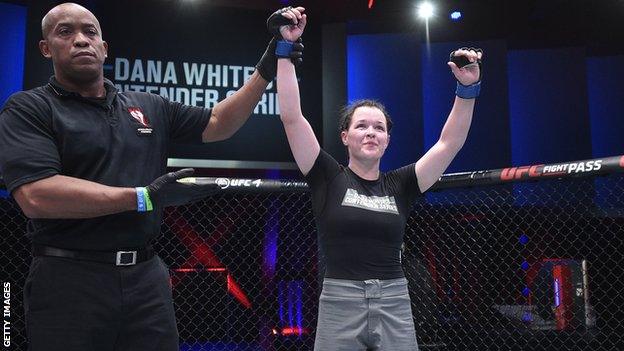 Cory McKenna celebrates after her victory over Vanessa Demopoulos