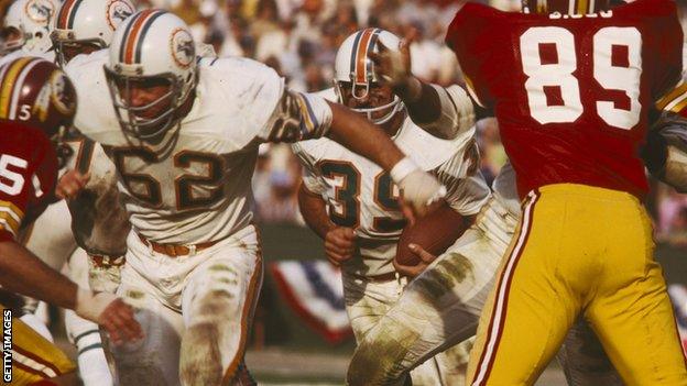 Miami Dolphins Hall of Fame centre Jim Langer (62) blocks for Hall of Fame full-back Larry Csonka in a 14-7 win over the Washington Redskins in Super Bowl VII on January 14, 1973 at Los Angeles Memorial Coliseum.