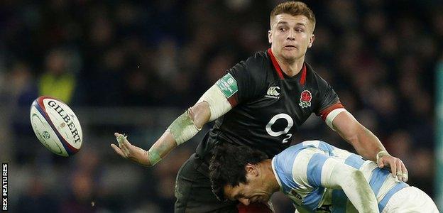 England centre Henry Slade offloads against Argentina