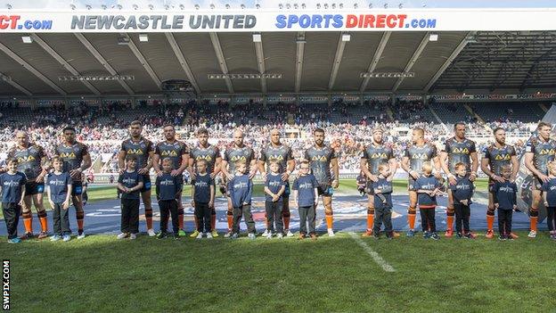 Castleford Tigers line up before the game with Wakefield at Magic Weekend