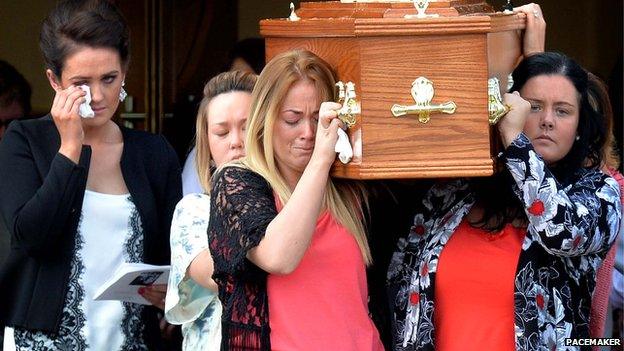 Friends carry Jennifer Dornan's coffin at her funeral