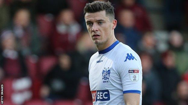 Callum Reilly in action for Bury