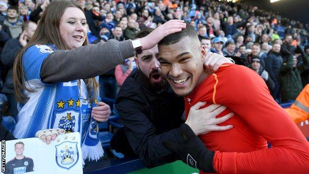 Collin Quaner celebrates after full-time with Huddersfield fans