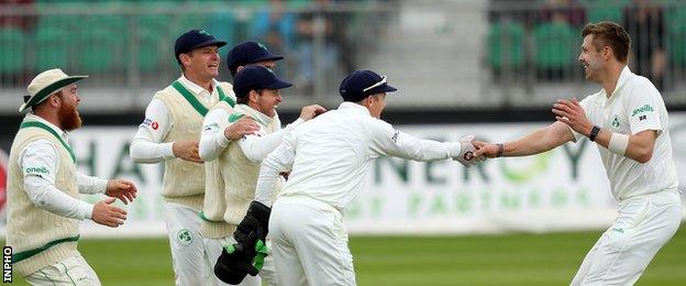 Boyd Rankin (right) is congratulated by his team-mates after taking the wicket of Haris Sohail