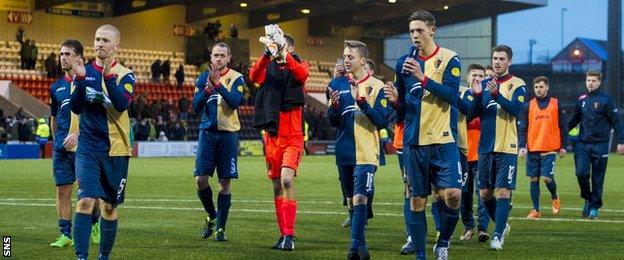 The East Kilbride players applaud their fans in Airdrie after the cup exit