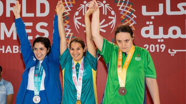 Ballygowan swimmer Emma Carlisle (right) finished the Games with a gold and a bronze