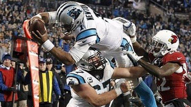 Cam Newton dives for a touchdown