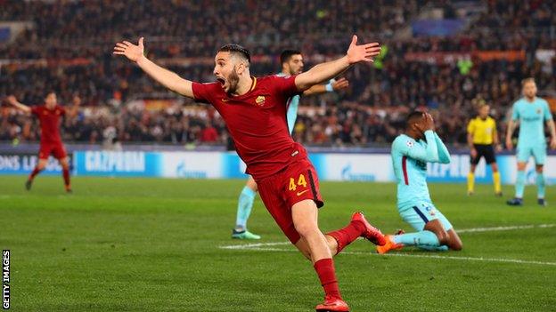 Roma celebrate a goal against Barcelona