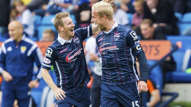 Ross County captain Andrew Davies (right) is joined by Michael Gardyne as he celebrates the fourth goal for his side