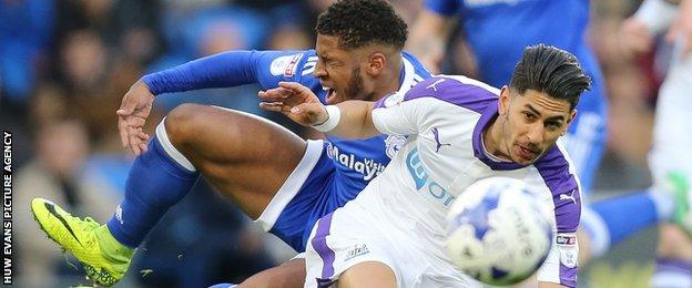 Cardiff City's Kadeem Harris is brought down by Ayoze Perez