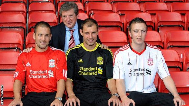 Joe Cole poses with Liverpool boss Roy Hodgson