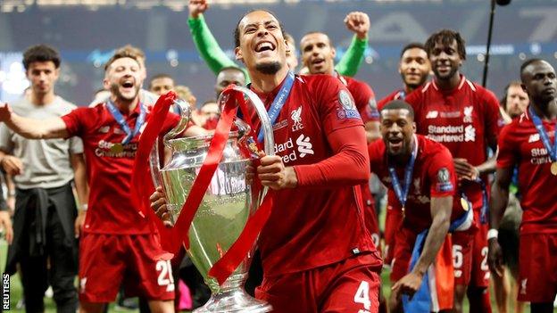 Liverpools Virgil van Dijk celebrates with the trophy after winning the Champions League Final