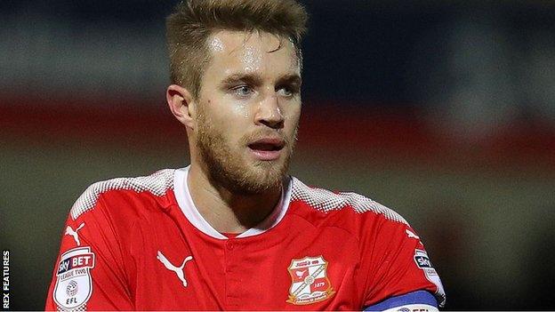 Olly Lancashire in action for Swindon