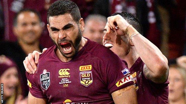 Greg Inglis celebrates with Darius Boyd