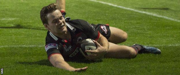 Edinburgh's Chris Dean scores a try