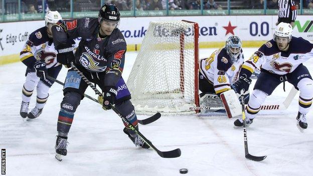 Belfast's Slater Doggett tries to keep an attack going with Guildford's Liam Hughes and Alex Yuill attempting to avert the danger