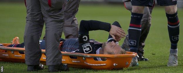 Ross County's Andrew Davies on a stretcher