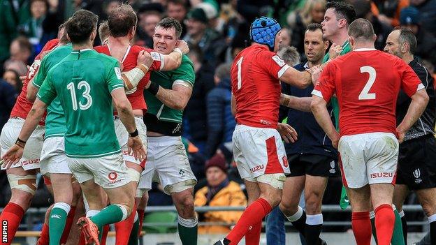 Alun Wyn Jones tangles with Peter O'Mahony as Wales prop Wyn Jones exchanges pleasantries with James Ryan