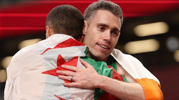 A delighted Jason Smyth embraces Algeria's Skander Djamil Athmani after winning the final