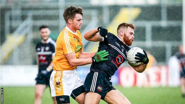 Kilcoo's Aaron Morgan in action against Clonduff's Patrick O'Hagan at Pairc Esler