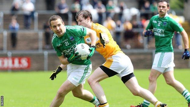 Daniel Kille shields the ball from Justin Crozier at Brewster Park