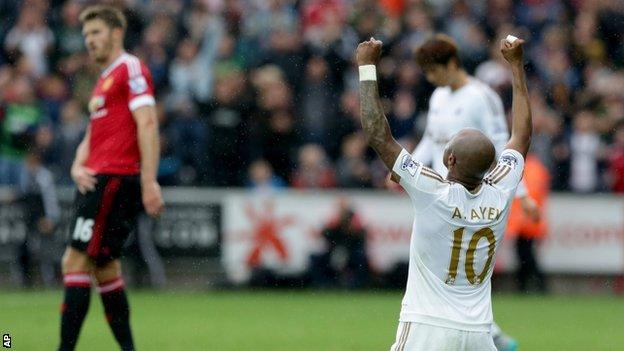 Andre Ayew and Michael Carrick