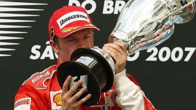 Finnish Formula One driver Kimi Raikkonen of Ferrari kisses his trophy during the podium ceremony of Brazil's GP, 21 October 2007