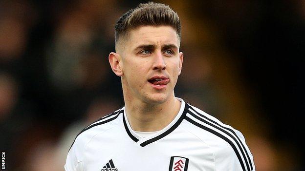 Tom Cairney walks out onto the pitch