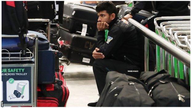 A Bangladesh player sits in silence at Christchurch airport