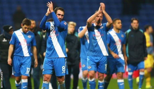 Eastleigh players applaud travelling fans