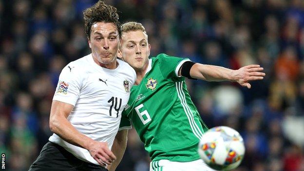 Julian Baumgartlinger and George Saville battle for possession at Windsor Park
