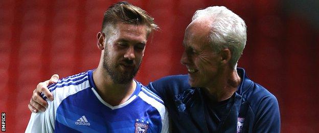 Mick McCarthy (right) consoling captain Luke Chambers