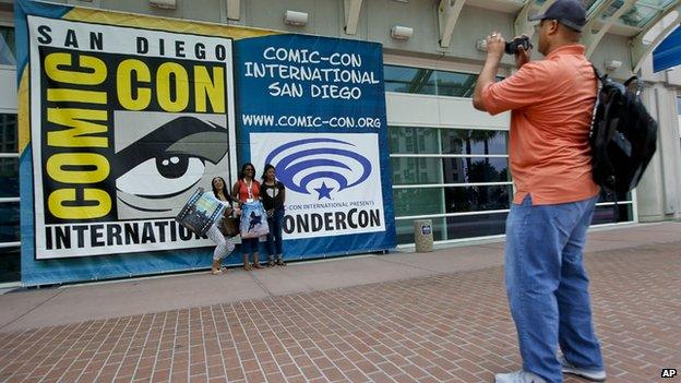 Fan taking photo outside the San Diego Convention Center