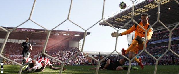 Liverpool keeper Simon Mignolet in action against Stoke City