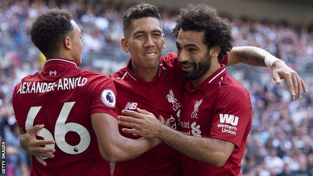 Liverpool forward Roberto Firmino celebrates scoring with Trent Alexander-Arnold and Mohamed Salah