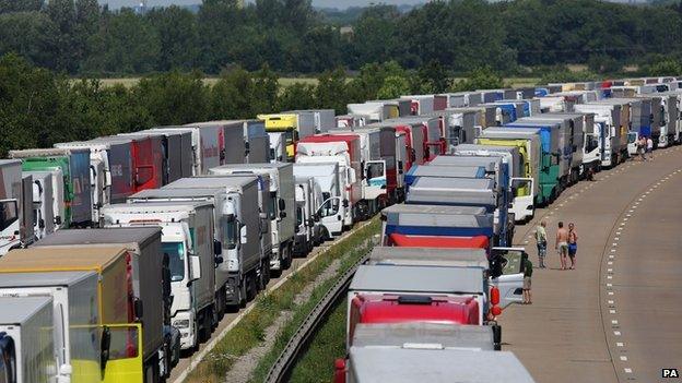 Lorries parked on both carriageways of the M20