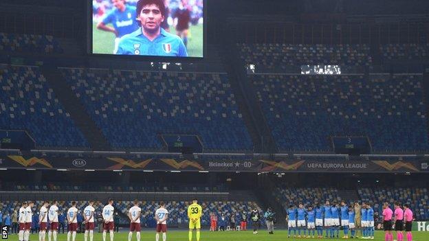 Napoli and Rijeka players observe a minute's silence in memory of Diego Maradona at the San Paolo stadium