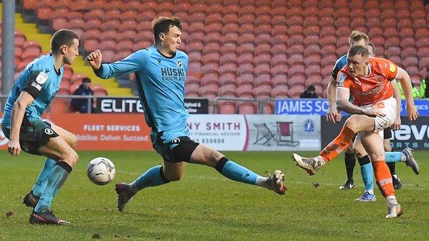 Shayne Lavery scores for Blackpool against Millwall