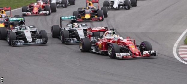 Sebastian Vettel leads into the first corner