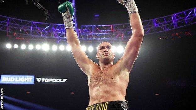 Tyson Fury celebrates after knocking down Deontay Wilder.