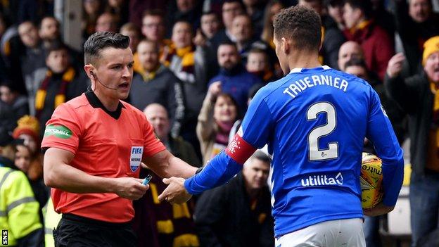 Items including a lighter, pie and coin all landed close to James Tavernier during Rangers' 3-0 win at Fir Park