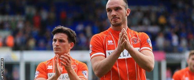 Blackpool players applaud their fans following their relegation to League Two