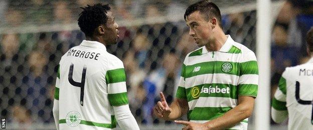 Efe Ambrose speaks with fellow Celtic defender Eoghan O'Connell