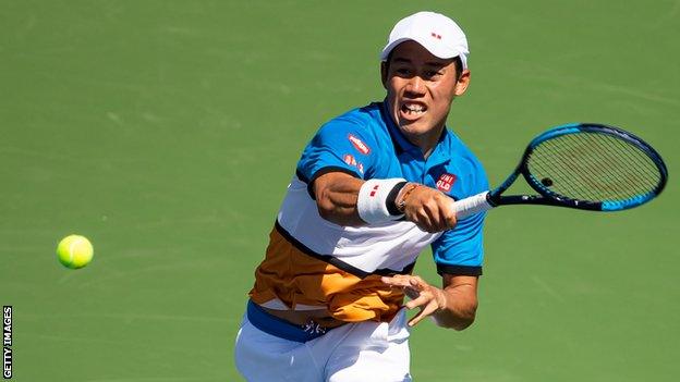 Kei Nishikori hits a return at the 2019 US Open