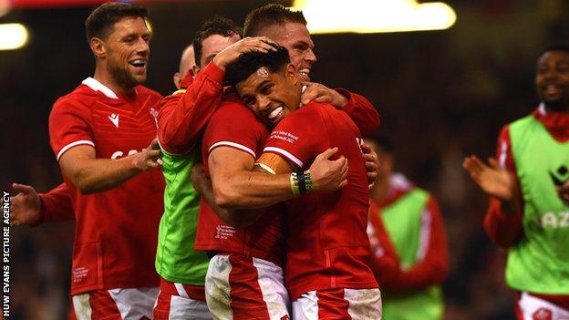 Rio Dyer is congratulated after scoring his first Wales try