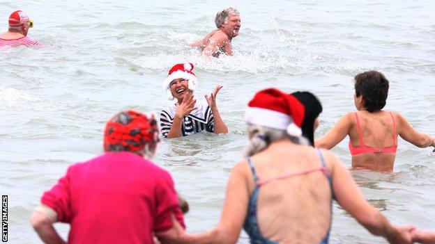 Swimmers taking part in a Christmas Day swim in Bournemouth