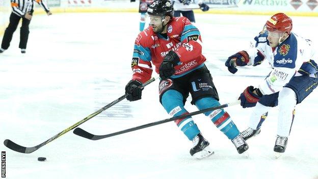 Belfast's Blair Riley is challenged by Capitals opponent Jay King in Saturday night's league game