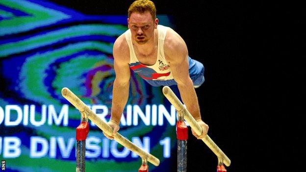 Team GB gymnast Daniel Purvis practices on the parallel bars