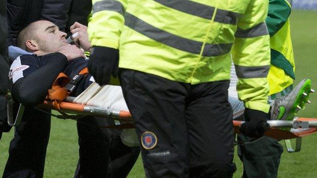 James McPake is stretchered off