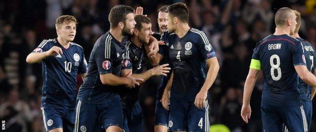 James McArthur celebrates his goal against Germany with Scotland team-mates